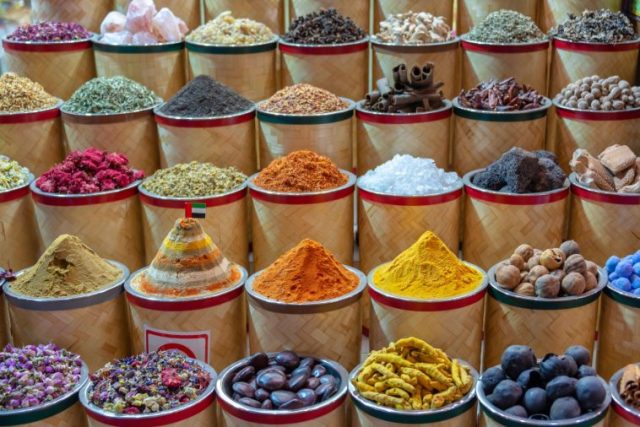 Colorful piles of spices in Dubai Souks United Arab Emirates